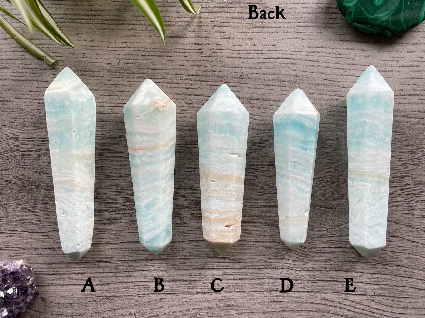 Pictured are various double terminated wands of caribbean calcite.