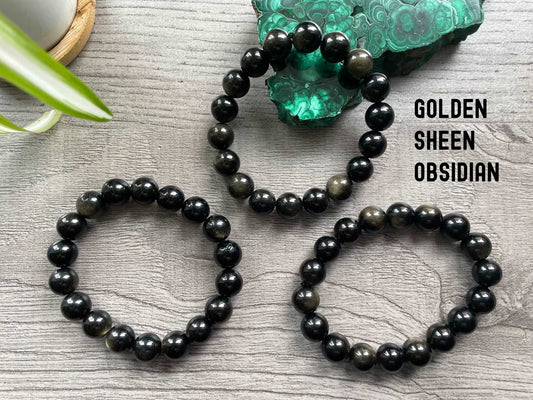 Pictured is a gold sheen obsidian bead bracelet.