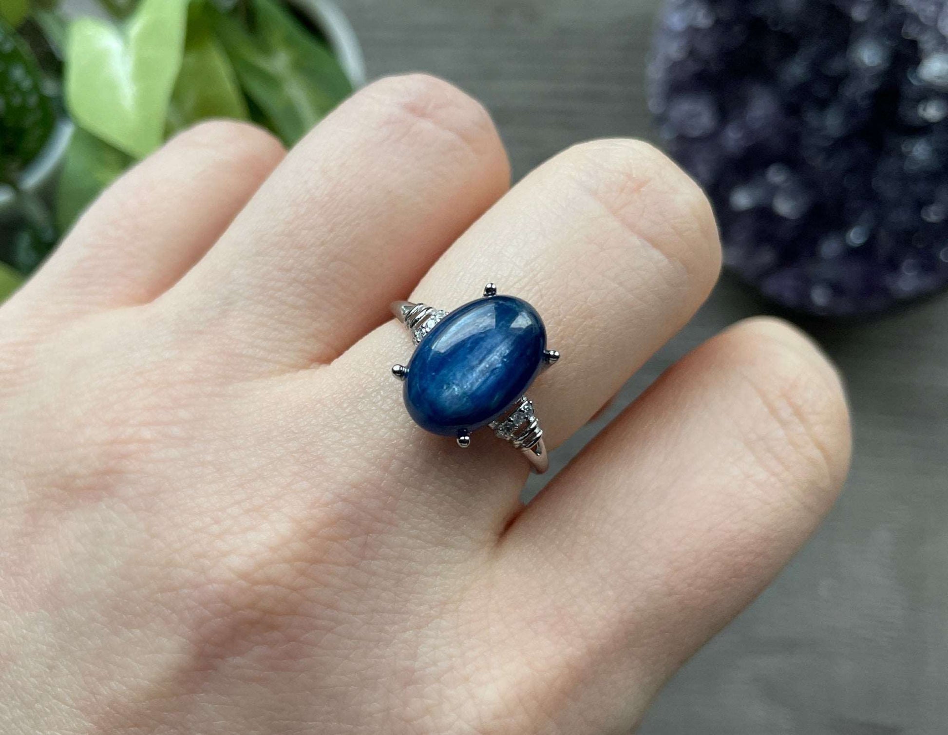 Pictured is a blue kyanite gemstone set in an S925 sterling silver ring.
