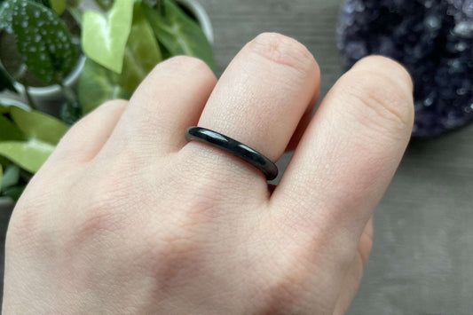 Pictured is a black jade ring.