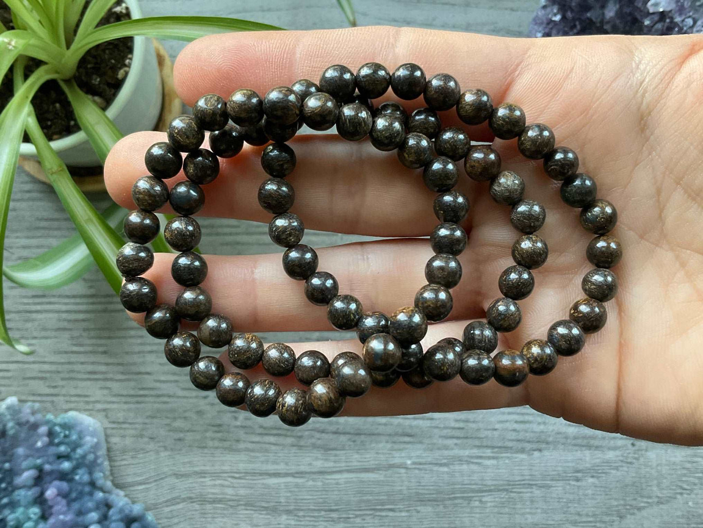 Pictured is a bronzite bead bracelet.