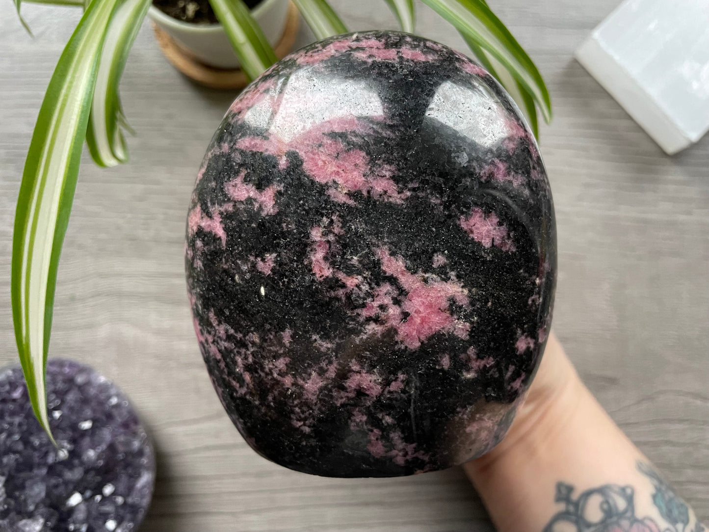 Pictured is a rhodonite freeform.