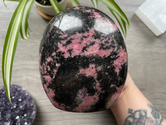 Pictured is a rhodonite freeform.