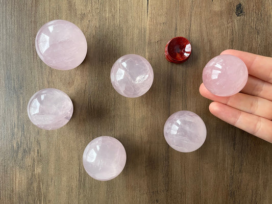 Pictured is a sphere carved out of rose quartz.