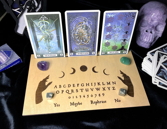 Pictured is a wood tarot card holder and divination board.