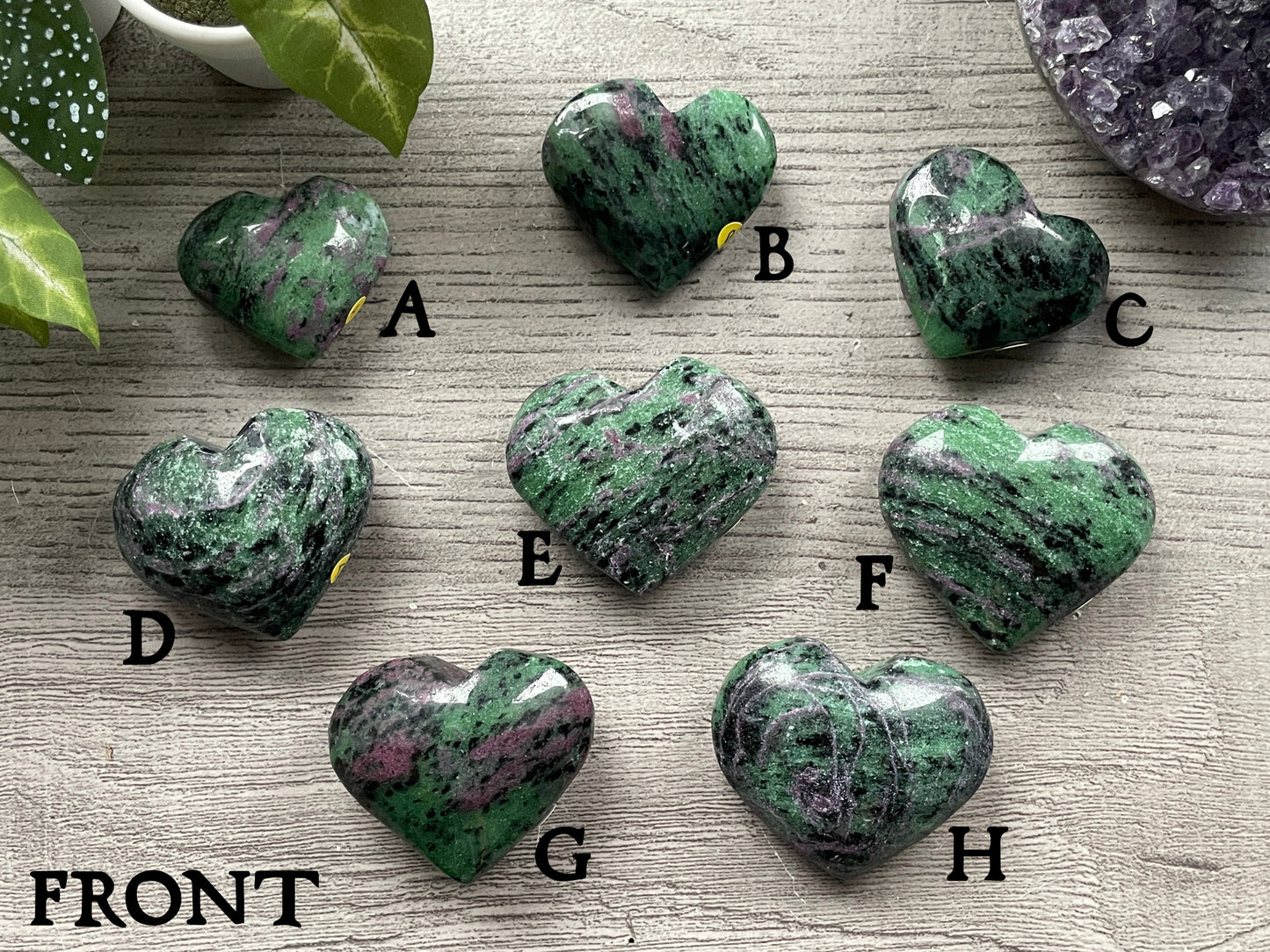 Pictured are various hearts carved out of ruby in zoisite.