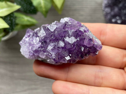 An image of a deep purple amethyst cluster.