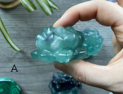 Pictured are various lotus flowers carved out of blue fluorite.