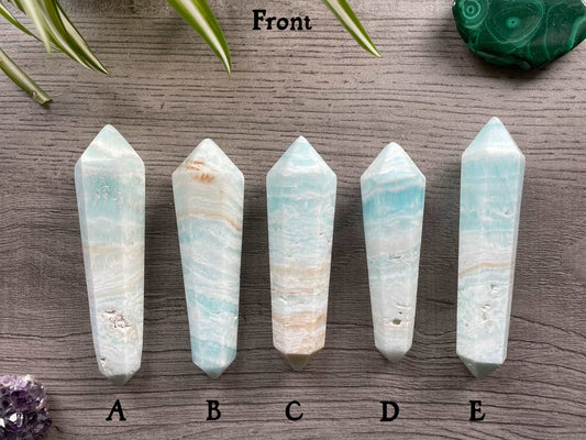 Pictured are various double terminated wands of caribbean calcite.