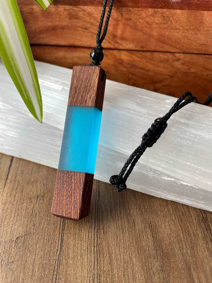 Pictured is a necklace made of wood and resin.