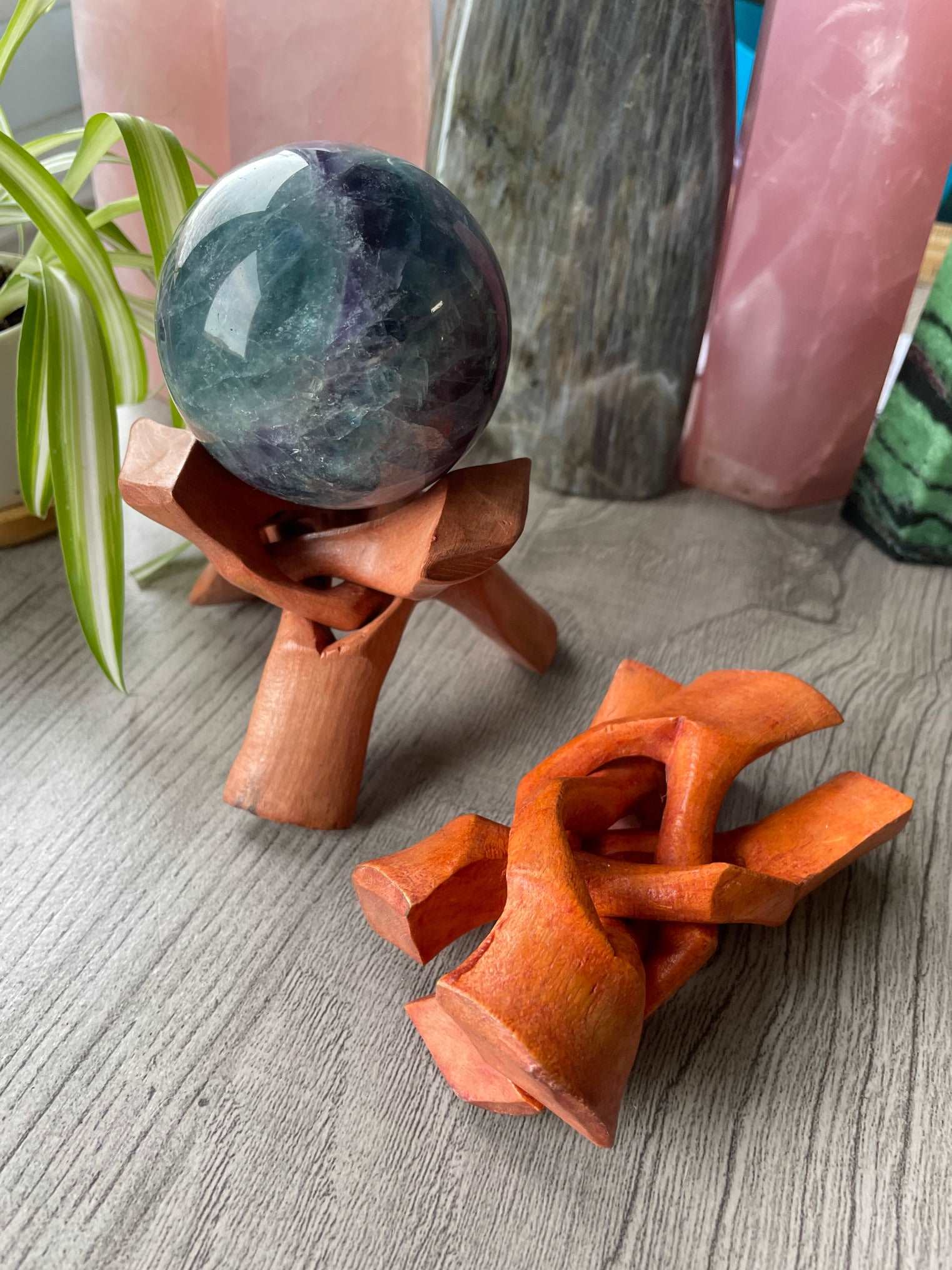 Pictured is a wood sphere stand.
