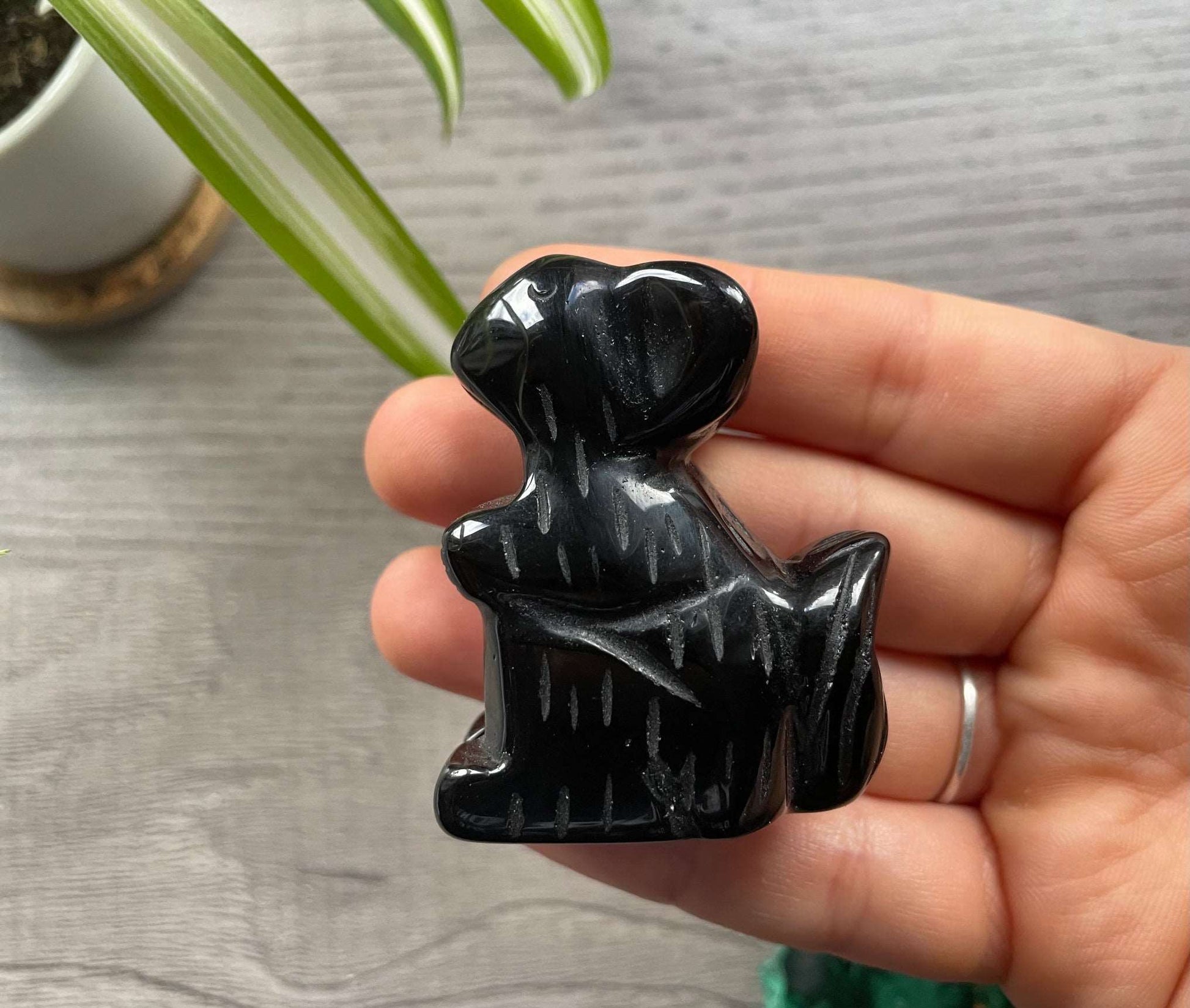 Pictured is a squirrel carved out of black obsidian.