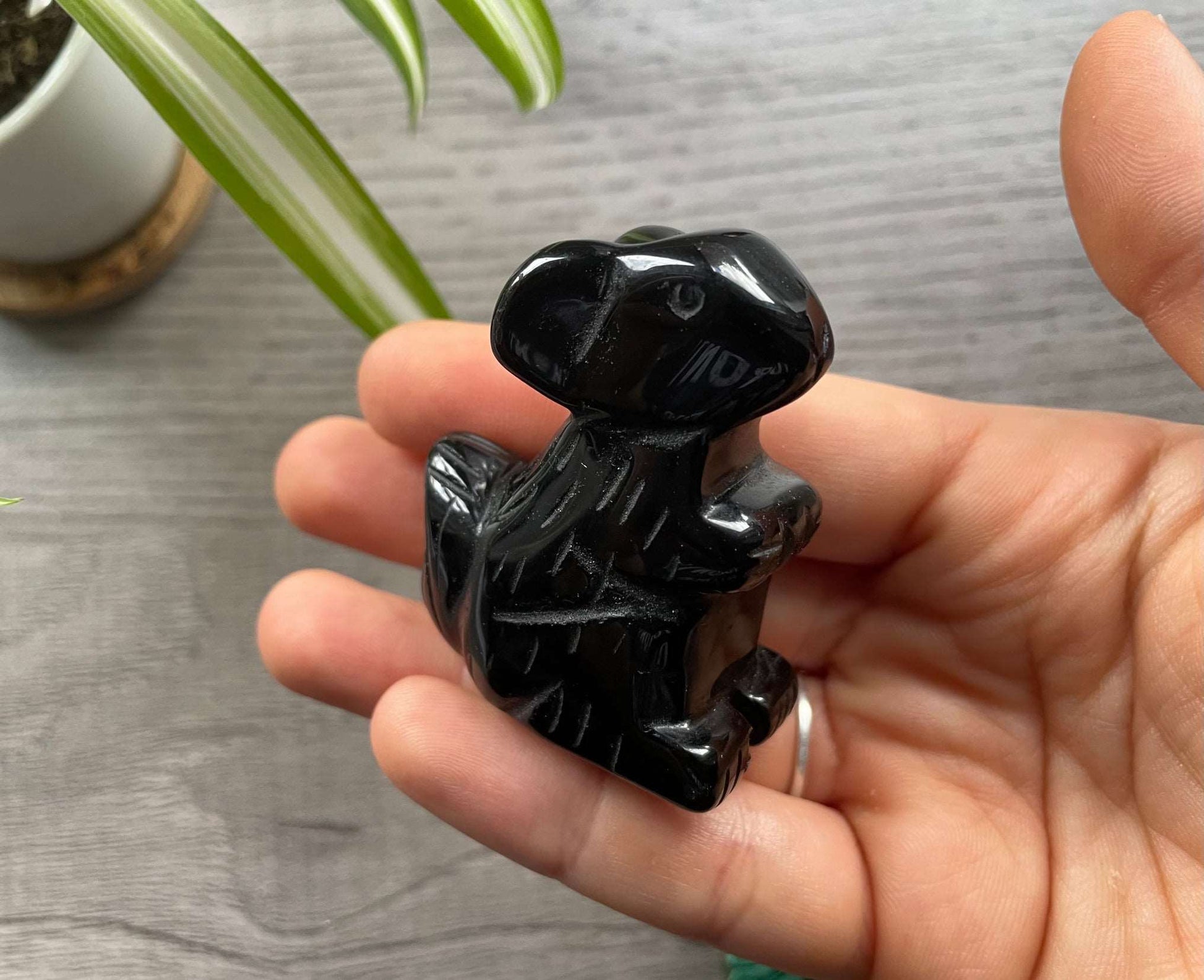 Pictured is a squirrel carved out of black obsidian.