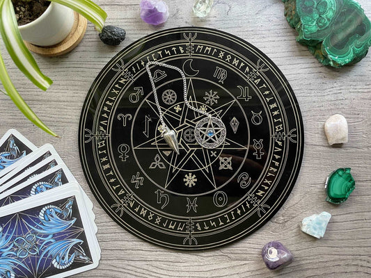 Pictured is a black acrylic divination board.