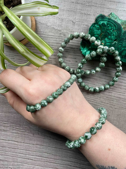 Pictured is a chinghai jade bead bracelet.