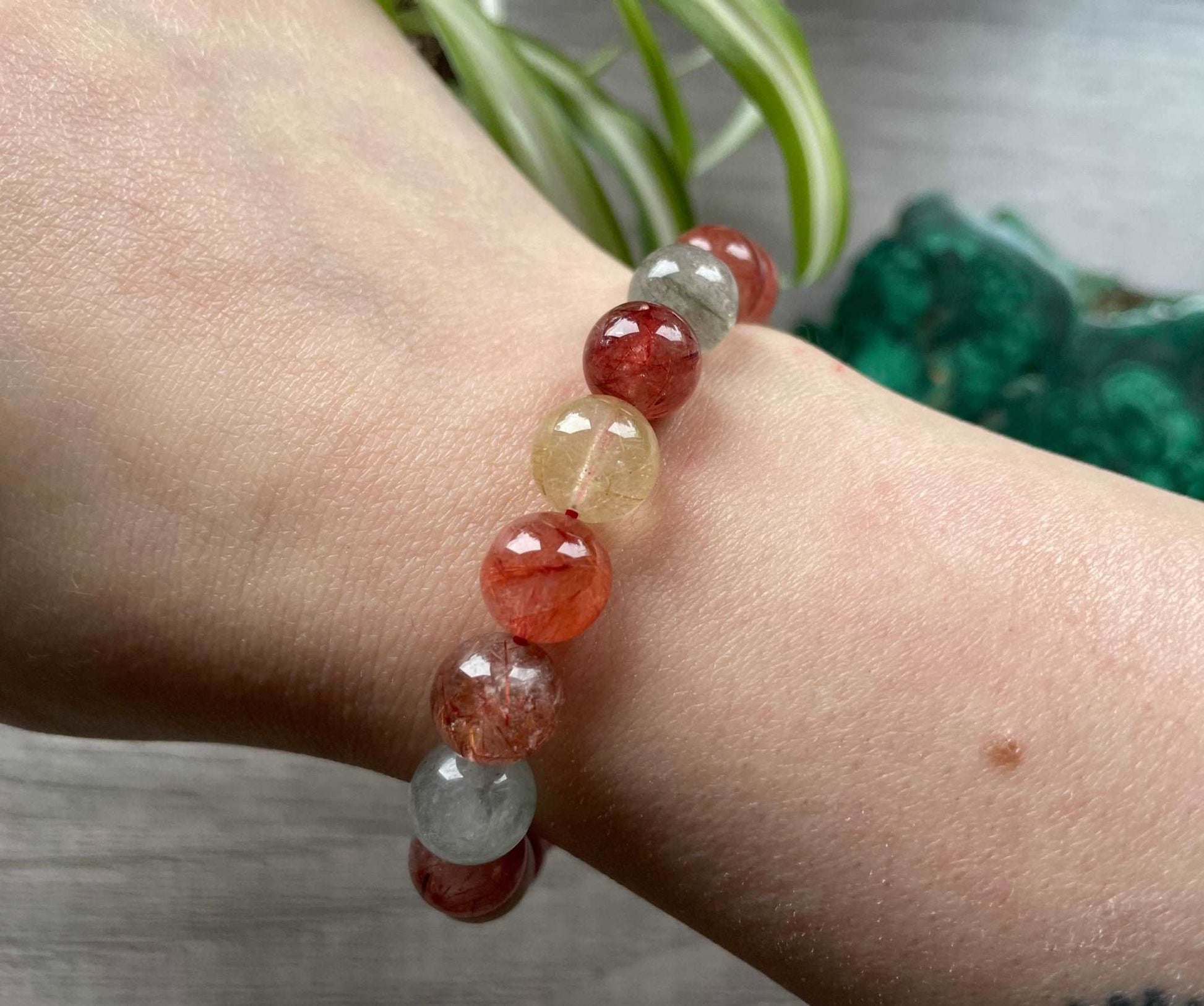 Pictured is a colourful rutilated quartz bead bracelet.
