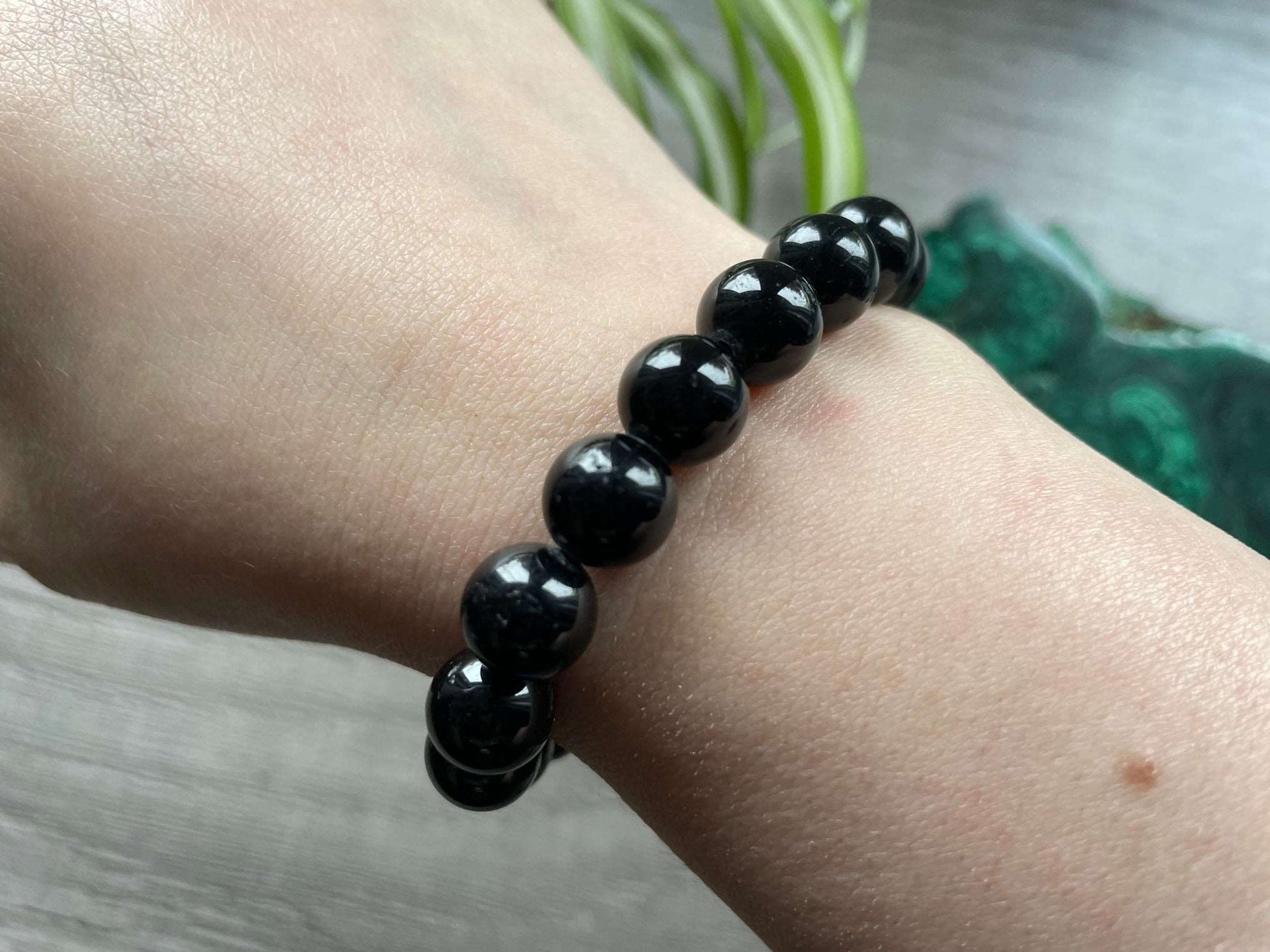 Pictured is a black tourmaline bead bracelet.
