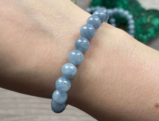 Pictured is an aquamarine bead bracelet.
