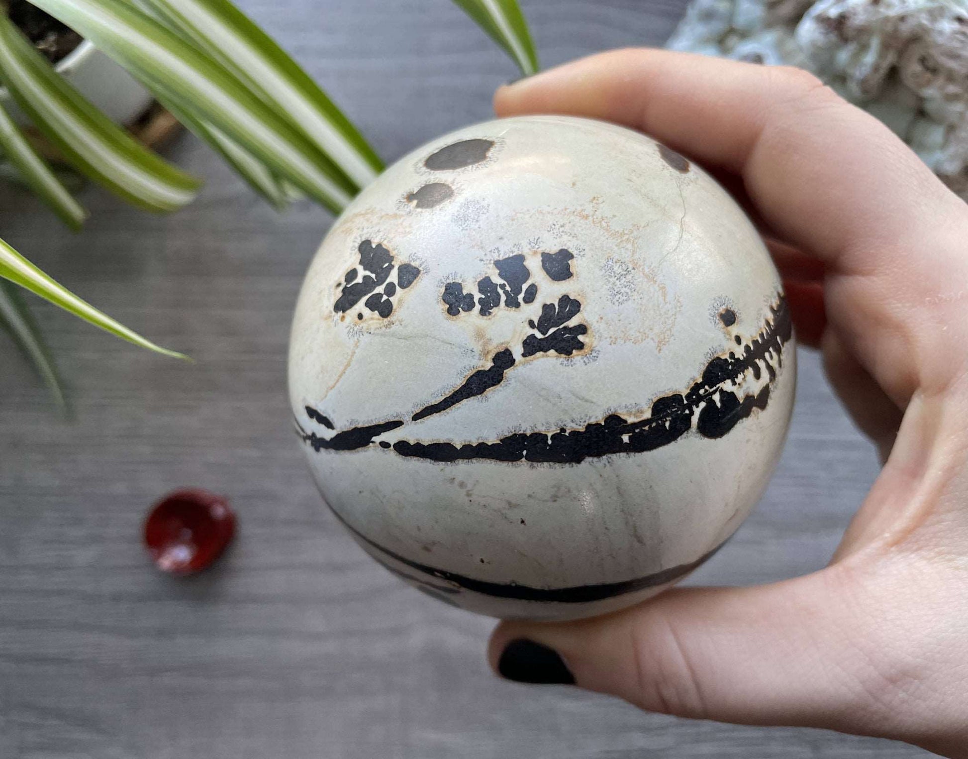 Pictured is a sphere carved out of Chinese painting stone.