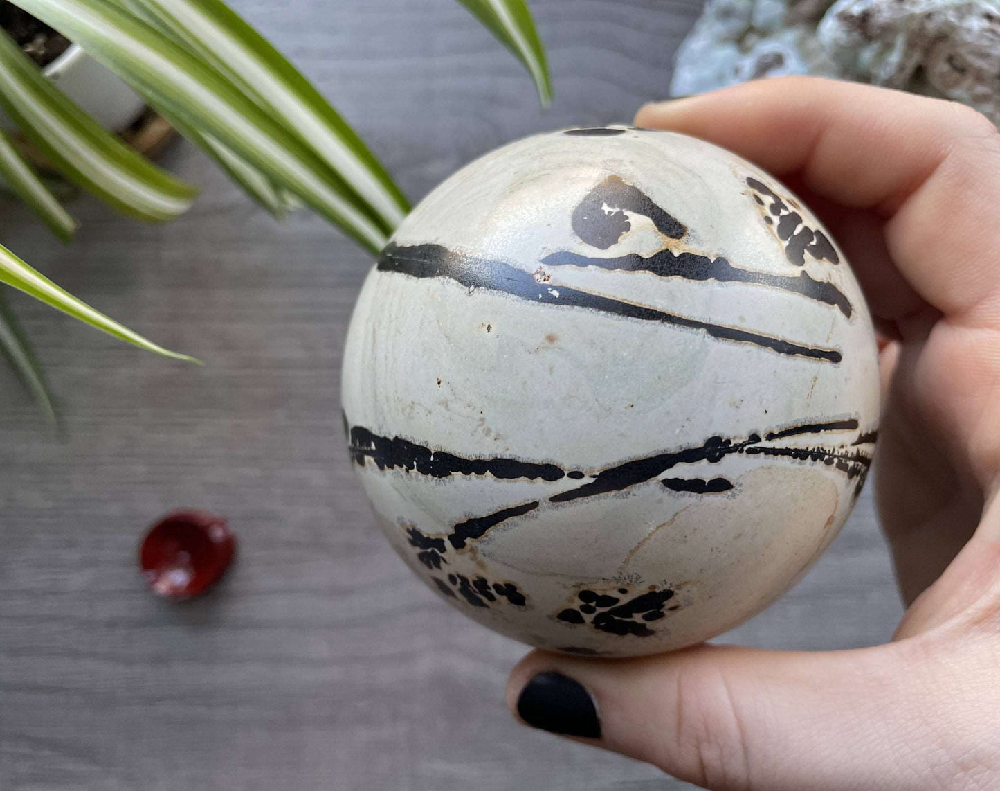 Pictured is a sphere carved out of Chinese painting stone.
