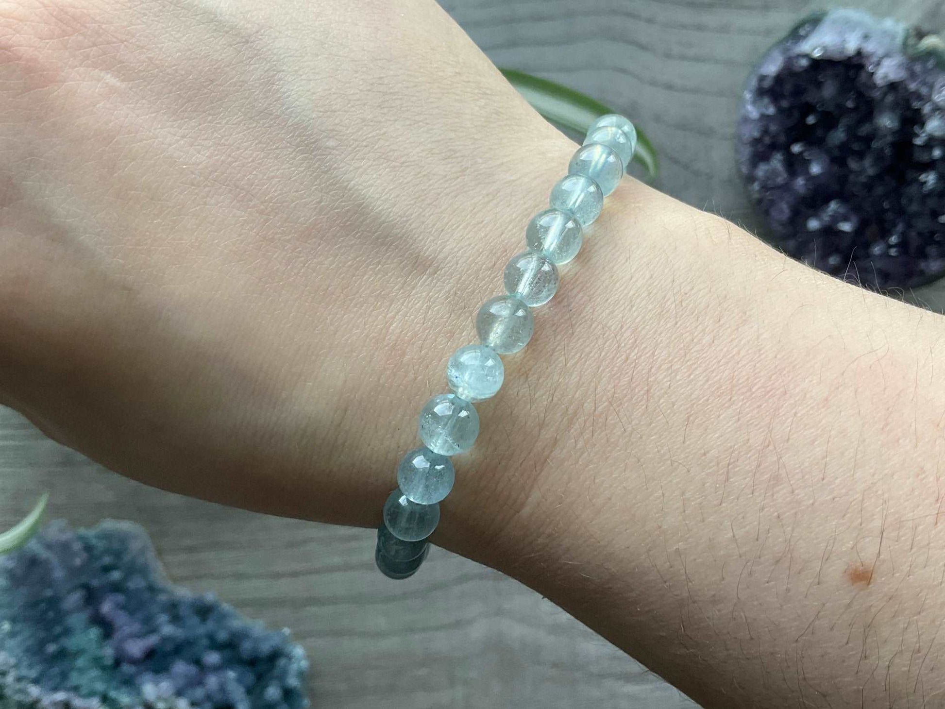 Pictured is an aquamarine bead bracelet.