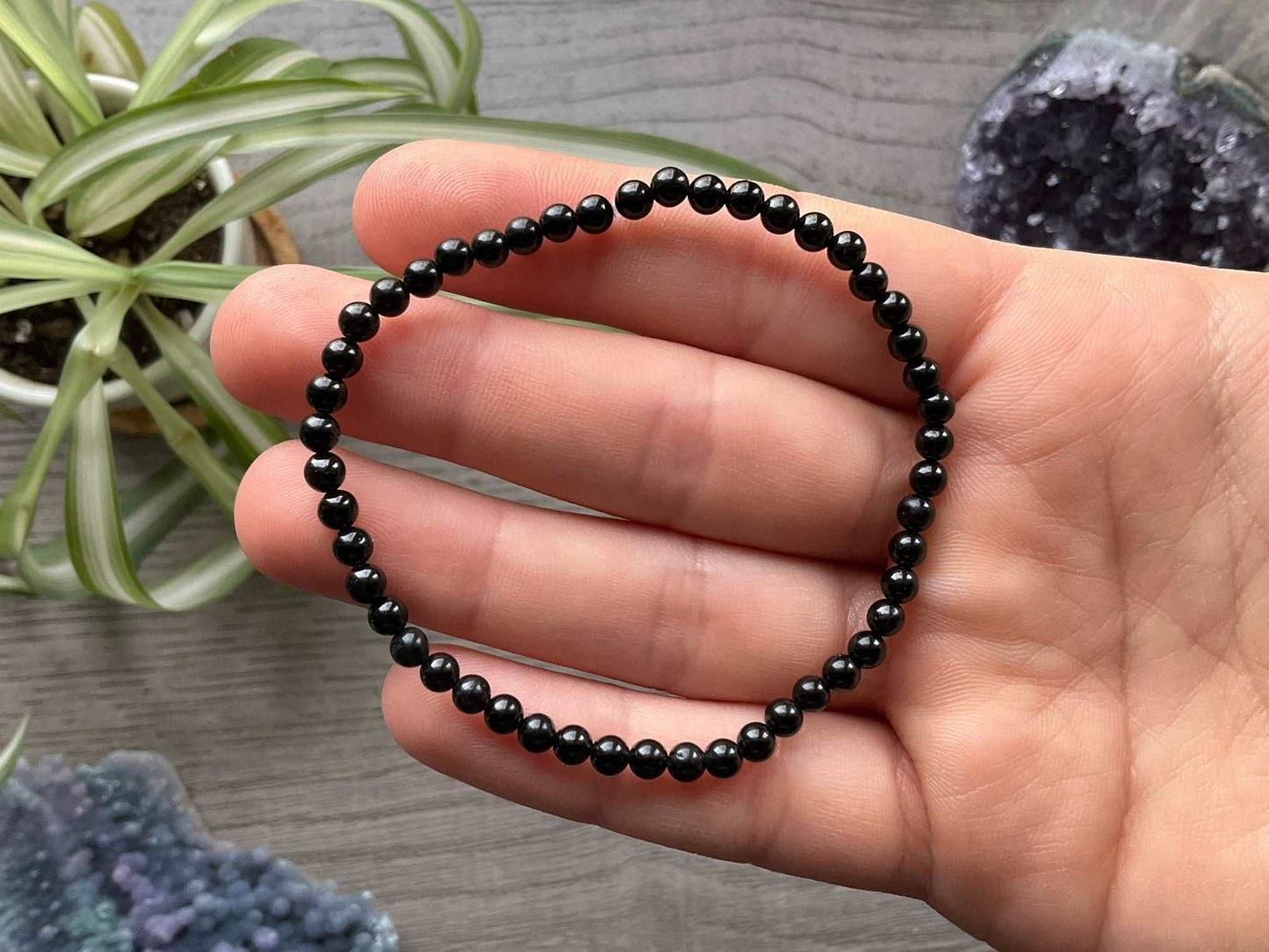 Pictured is a black tourmaline bead bracelet.
