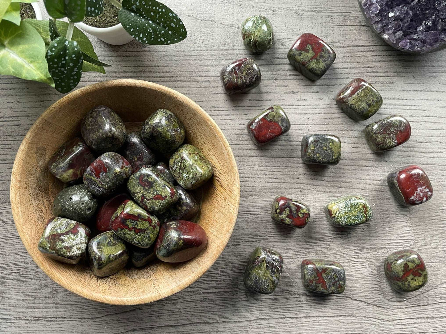 Pictured are various dragon bloodstone tumbled stones.