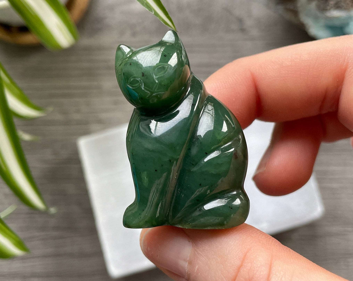 Pictured is a Canadian jade (nephrite jade) cat carving.