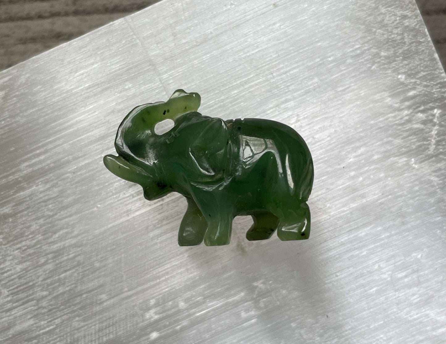 Pictured is an elephant carved out of Canadian jade / nephrite jade..