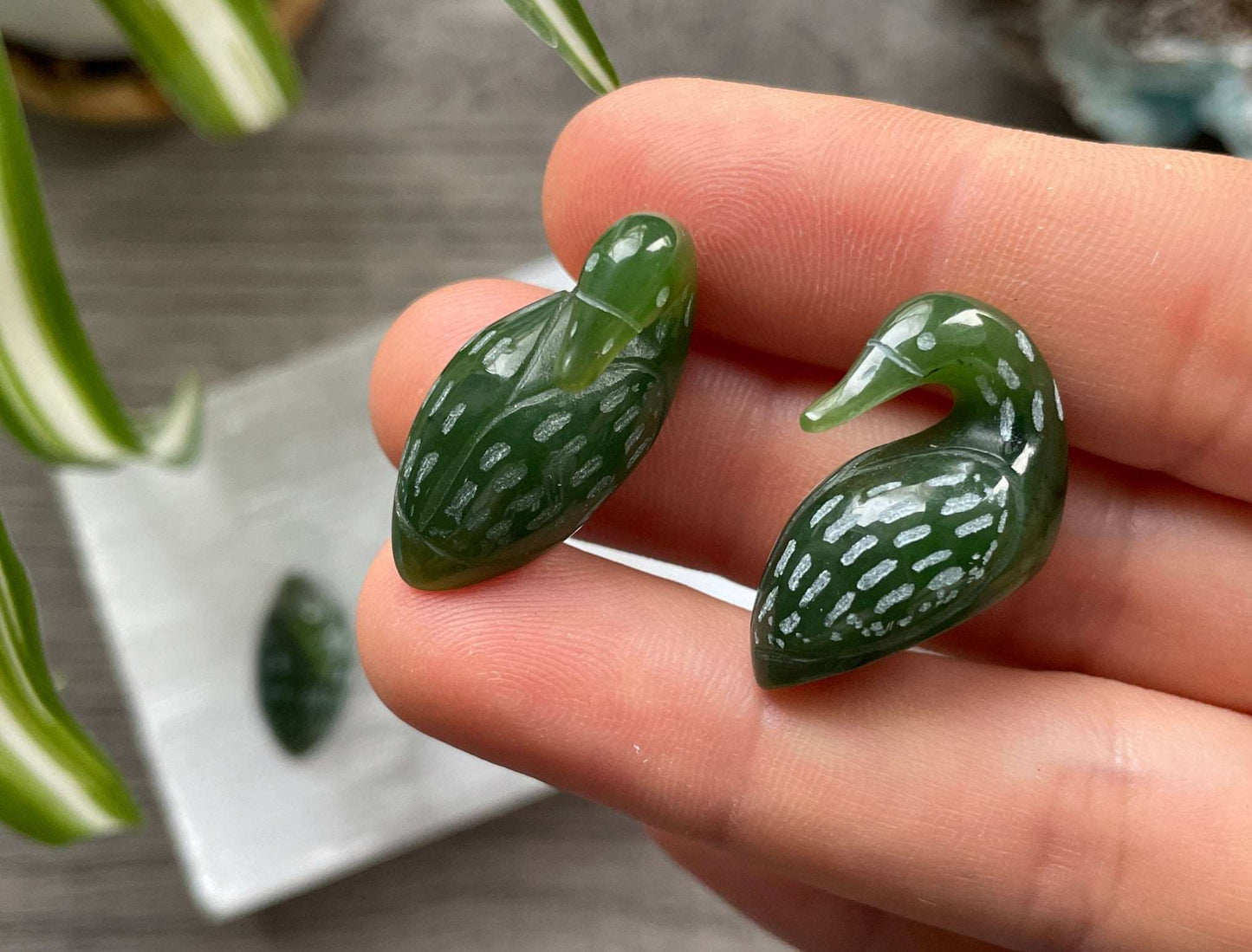 Pictured is a Canadian jade (nephrite jade) carved loon duck.