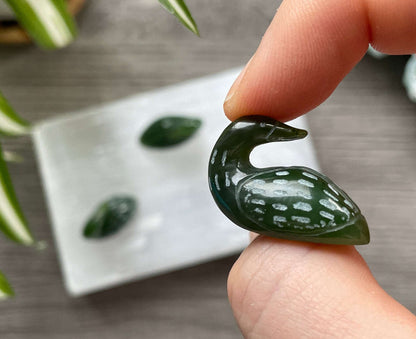 Pictured is a Canadian jade (nephrite jade) carved loon duck.