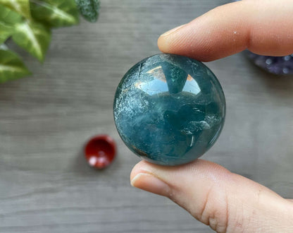 Pictured is a sphere carved out of blue fluorite.