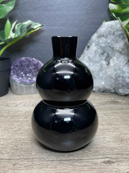 Pictured is a large gourd carved out of black obsidian.