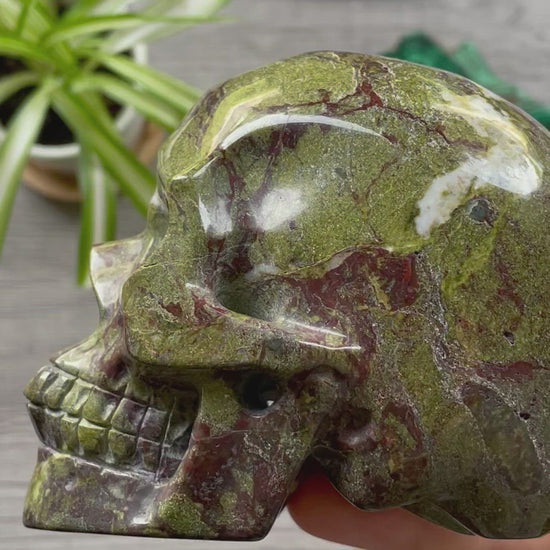 Pictured is a large skull carved out of dragon bloodstone jasper.