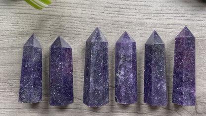 Pictured are various points of lepidolite.