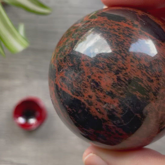 Pictured is a sphere carved out of mahogany obsidian.