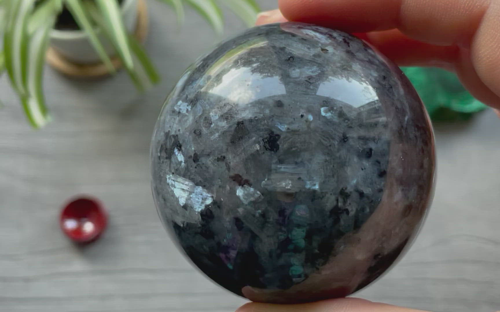 Pictured is a sphere carved out of larvikite.