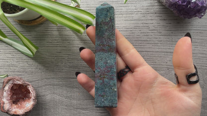 Pictured is a ruby in kyanite obelisk. 