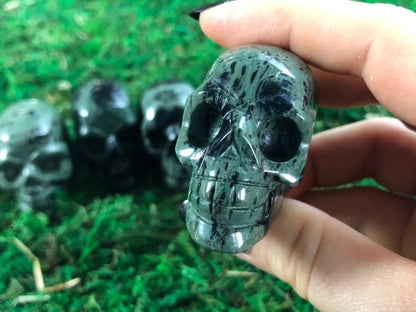 Pictured are various small skulls carved out of Kambaba jasper.
