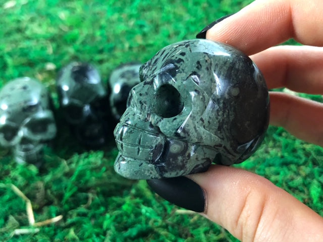 Pictured are various small skulls carved out of Kambaba jasper.