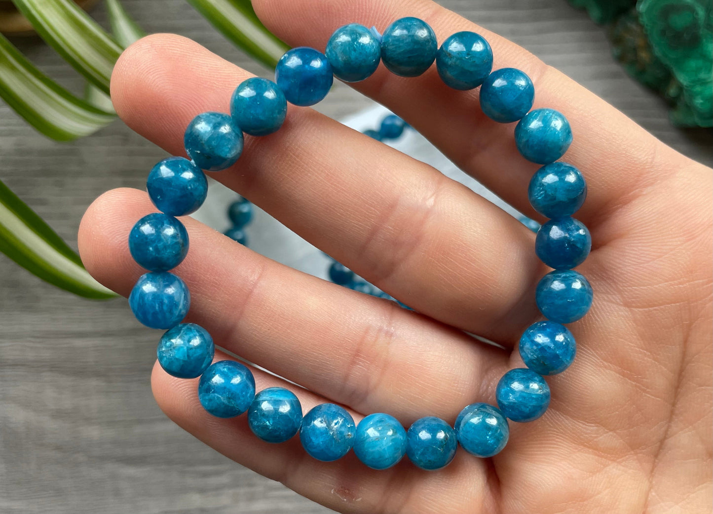 Pictured is a blue apatite bead bracelet.