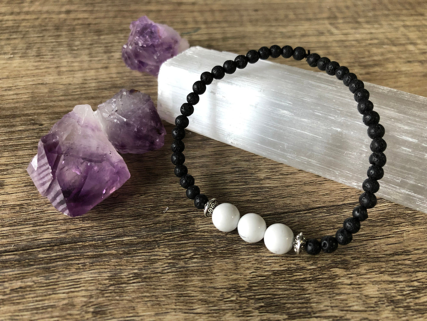 Pictured is a howlite and lava bead bracelet.