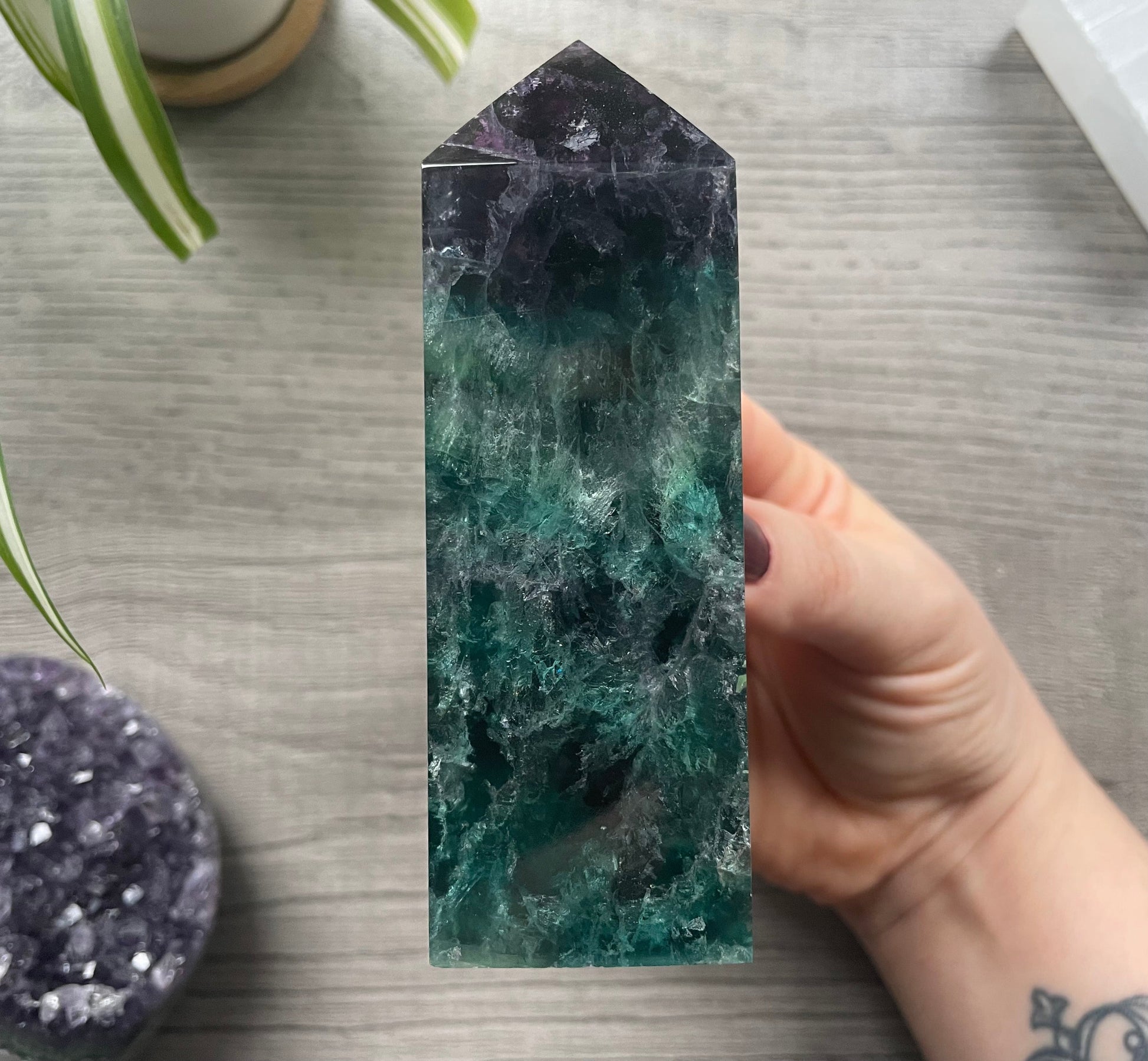 Pictured is a rainbow fluorite obelisk. 