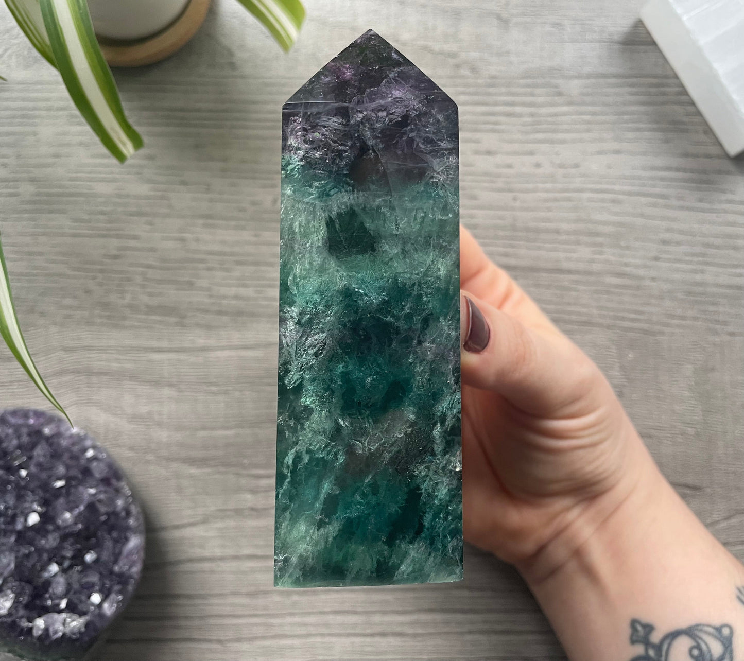 Pictured is a rainbow fluorite obelisk. 