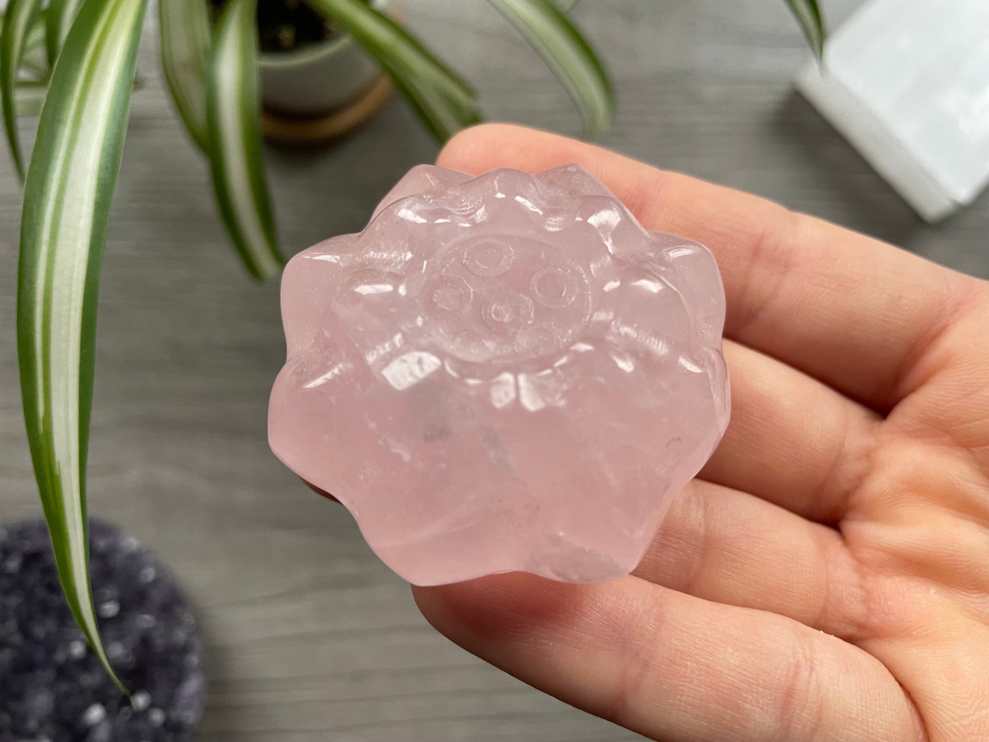 Pictured is a lotus flower carved out of rose quartz.