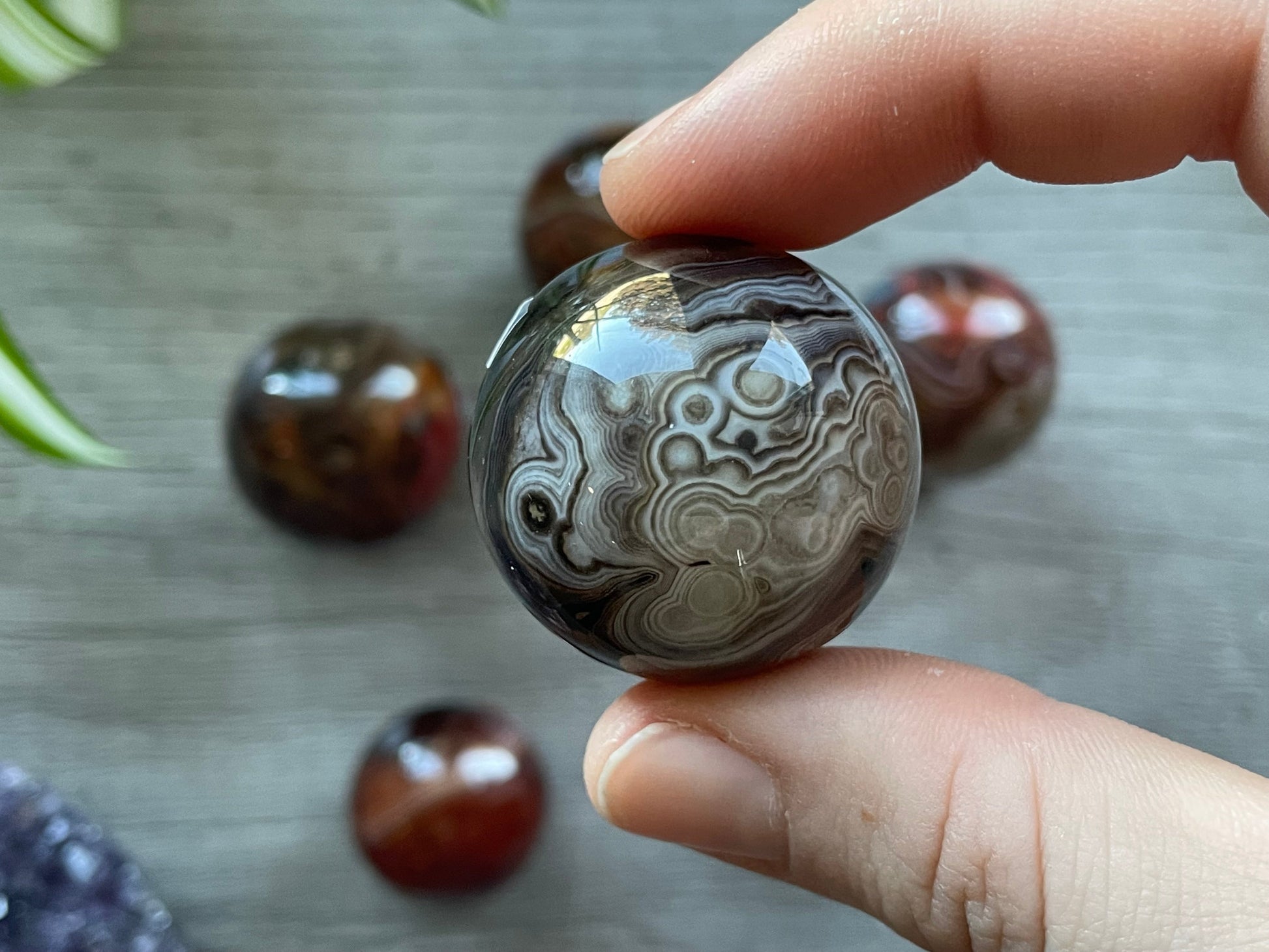 Pictured is a sphere carved out of sardonyx agate.