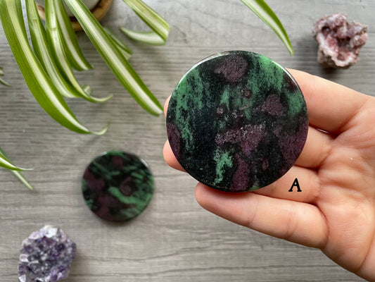 Pictured is a ruby in zoisite crystal coin.