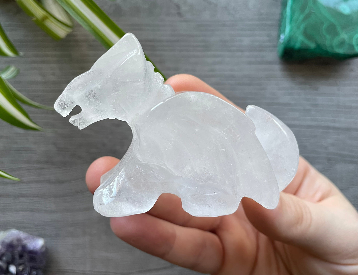 Pictured is a dragon carved out of clear quartz.