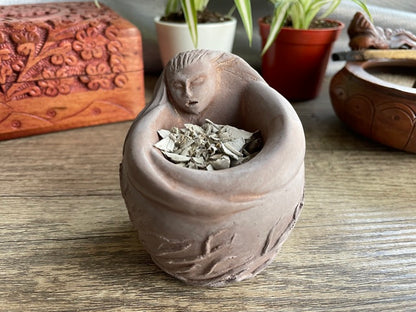 Pictured is an incense bowl or offering bowl carved out of gypsum in the shape of a goddess.