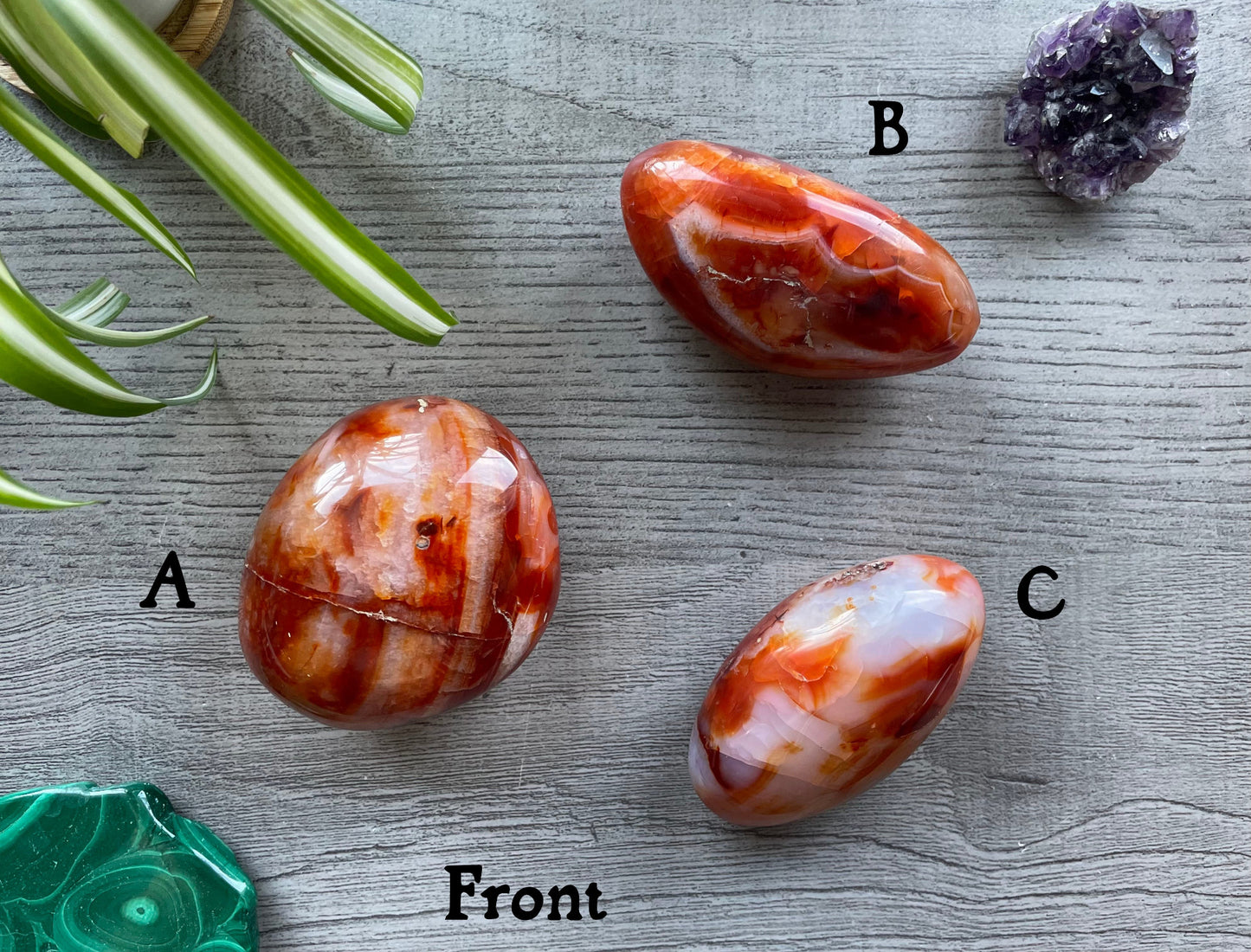 Pictured are various polished carnelian stones.